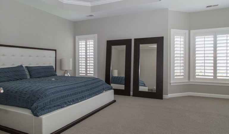 Polywood shutters in a minimalist bedroom in Washington DC.